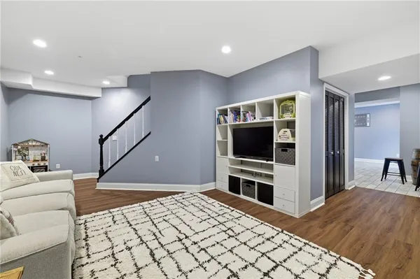 a room with furniture and a flat screen tv