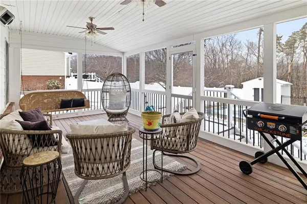 a outdoor dining space with furniture and wooden floor
