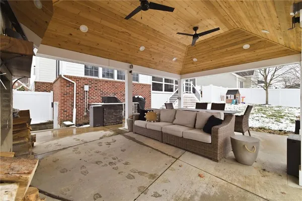 a view of a balcony with door and outdoor seating