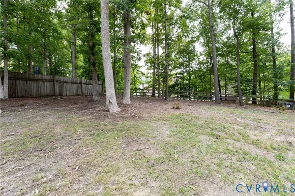 a view of a backyard with trees
