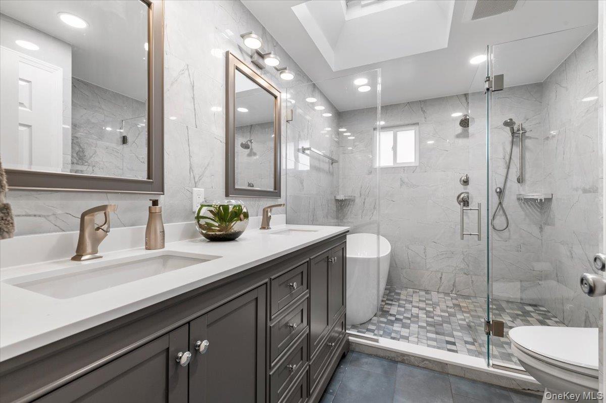 2747 Barbara Road Bellmore, NY 11710 - Photo 13 of 28 New Bathroom On Main Level w/ Enclosed Shower & Bath, Bidet and Double Sink Vanity.