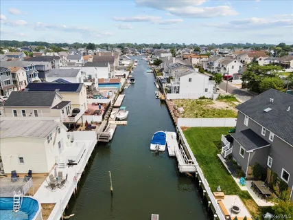 an aerial view of a house with a ocean view