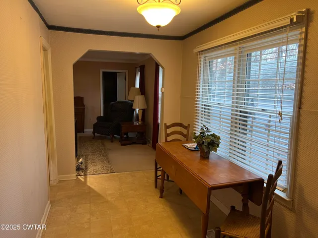 a view of a workspace with furniture