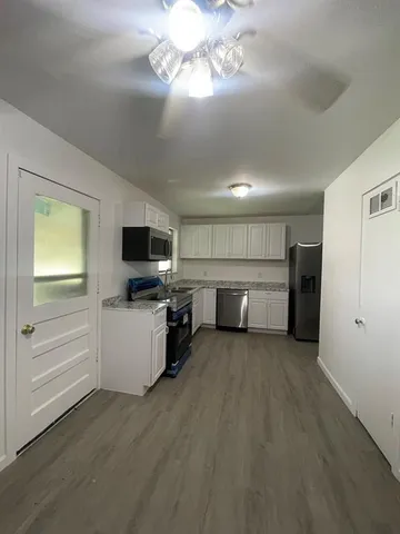 a view of a kitchen with a sink cabinets and a kitchen
