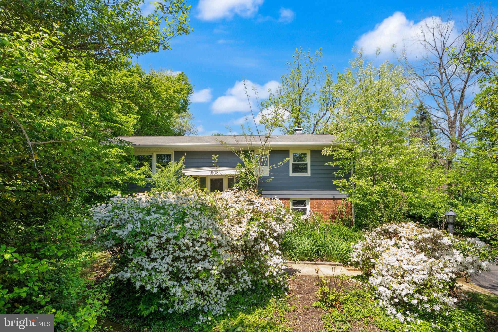 1608 Chain Bridge Road McLean, VA 22101 - Photo 2 of 37 a front view of a house with a yard