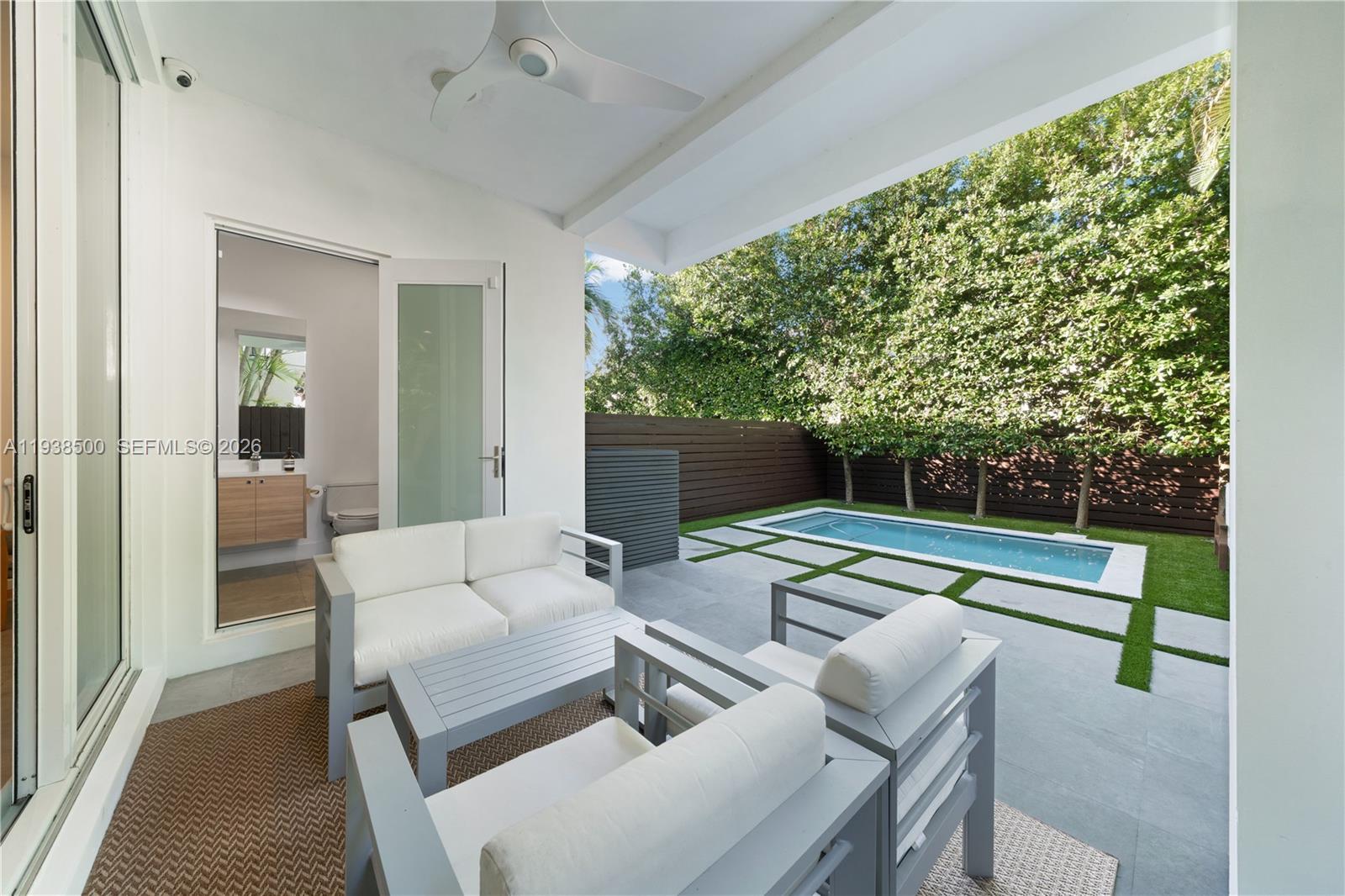 3072 Indiana Street, Unit 3072 Coconut Grove, FL 33133 - Photo 19 of 51 a outdoor living space with furniture and a flat screen tv