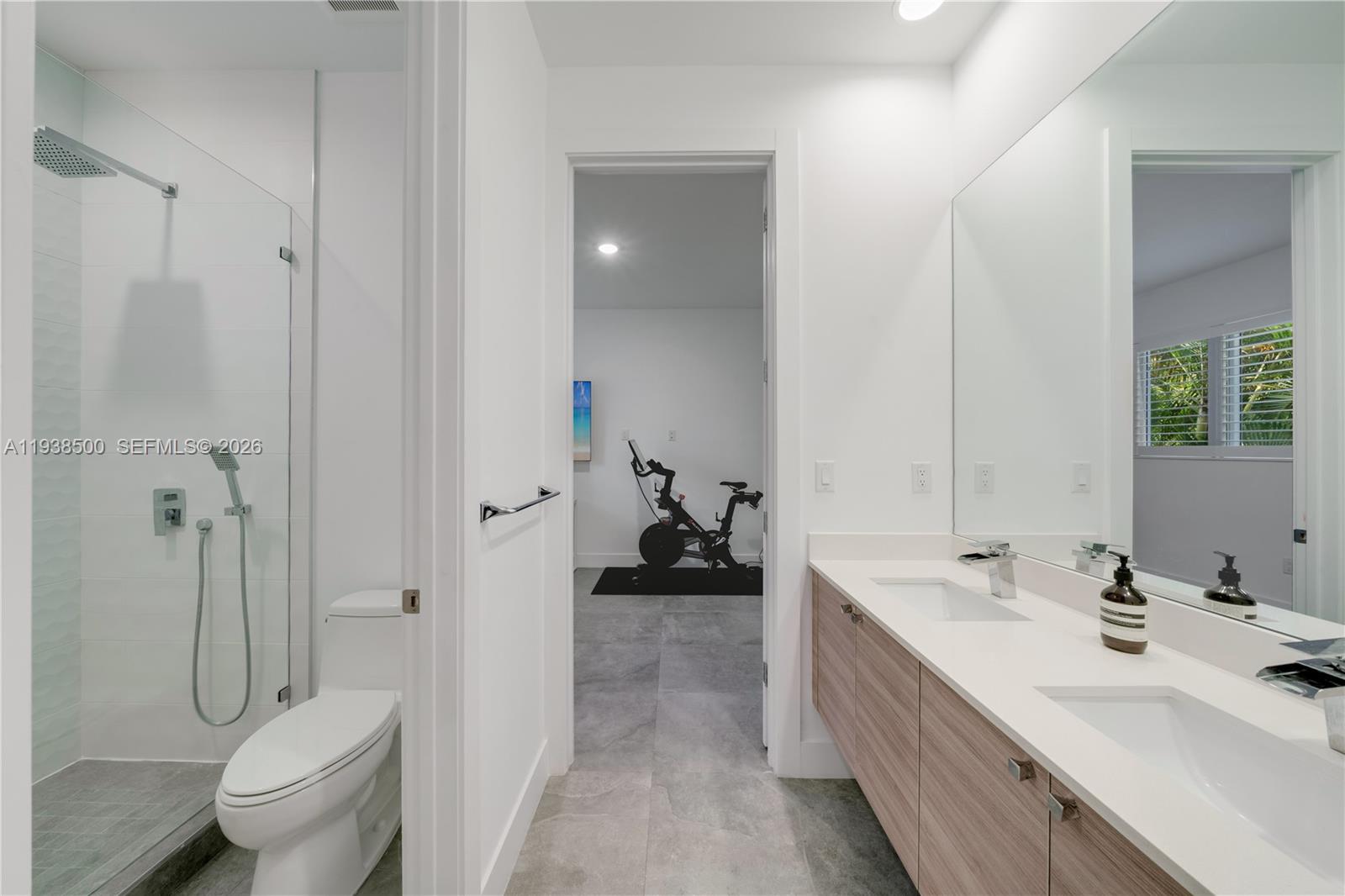 3072 Indiana Street, Unit 3072 Coconut Grove, FL 33133 - Photo 33 of 51 a bathroom with a double vanity sink toilet and shower