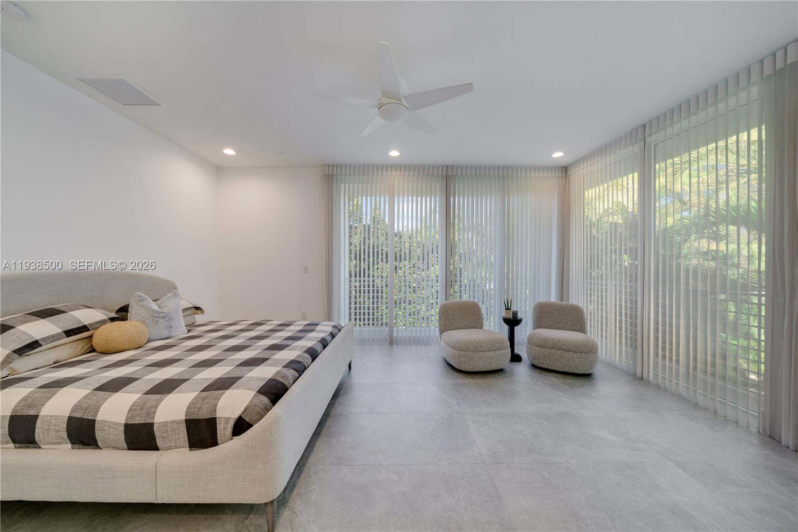 3072 Indiana Street, Unit 3072 Coconut Grove, FL 33133 - Photo 35 of 51 a spacious bedroom with a bed and glass window