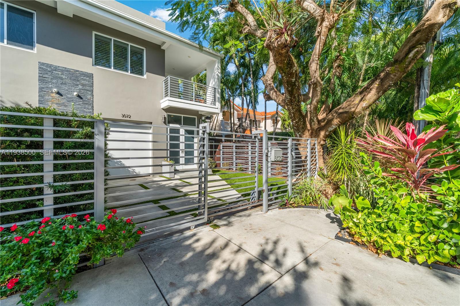 3072 Indiana Street, Unit 3072 Coconut Grove, FL 33133 - Photo 47 of 51 a view of a house with a flower garden