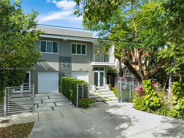 an aerial view of a house with a yard basket ball court and outdoor seating