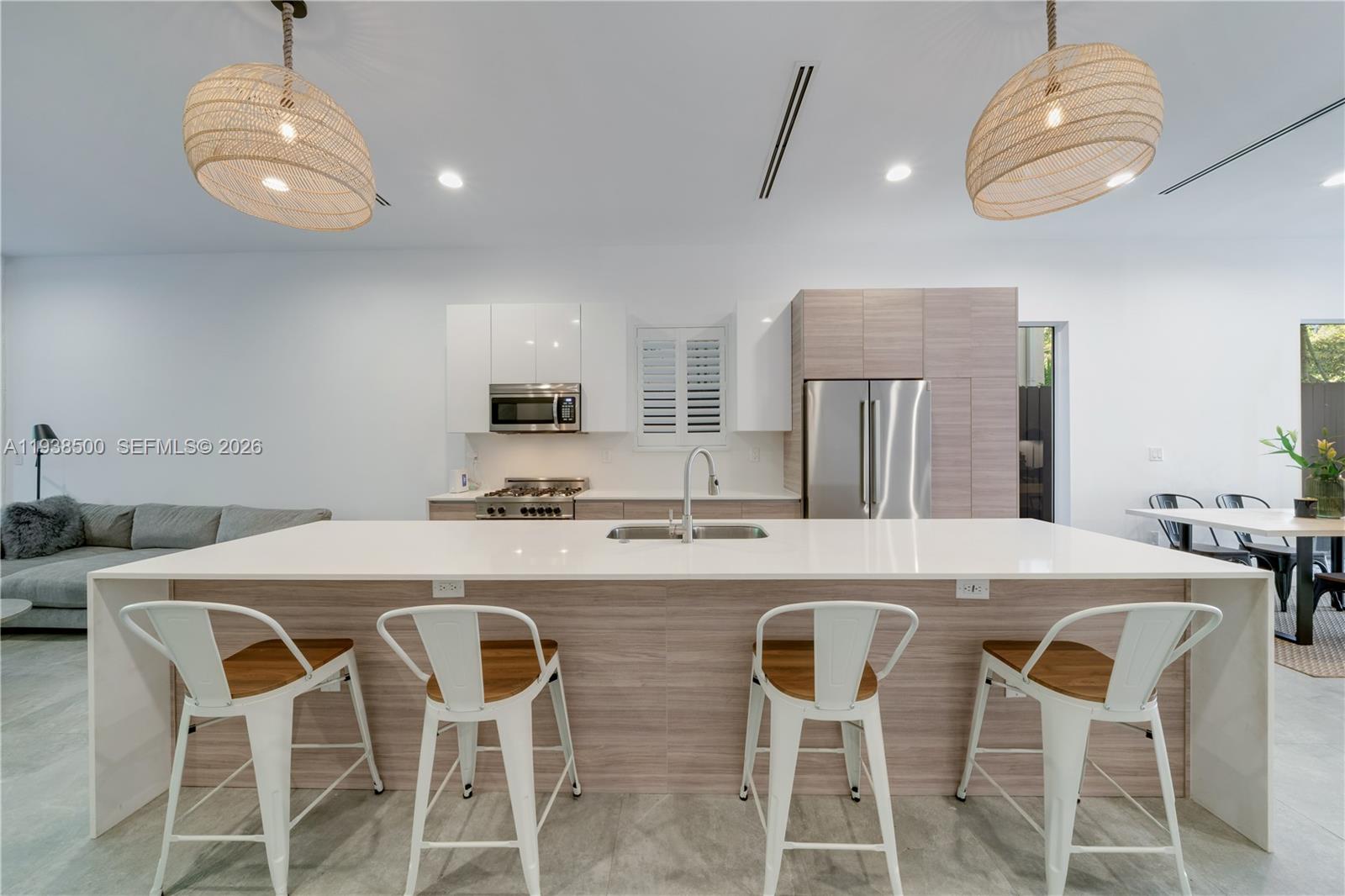 3072 Indiana Street, Unit 3072 Coconut Grove, FL 33133 - Photo 10 of 51 a kitchen with a dining table and chairs
