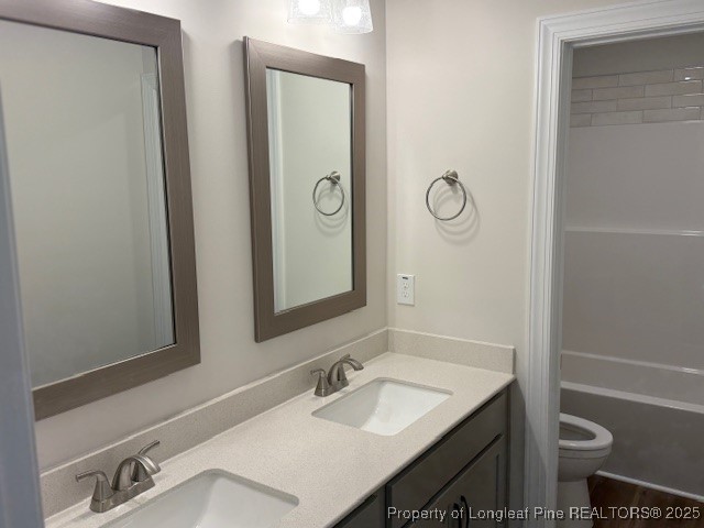 178 Surles Landing Way Benson, NC 27504 - Photo 13 of 21 a bathroom with a granite countertop sink toilet and shower