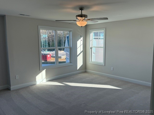 178 Surles Landing Way Benson, NC 27504 - Photo 16 of 21 an empty room with windows and fan