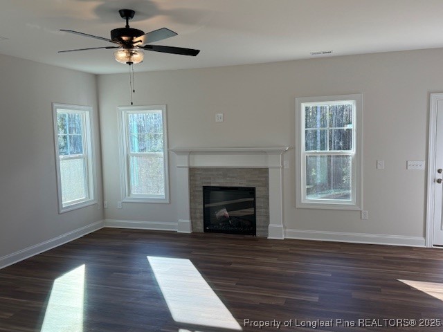 178 Surles Landing Way Benson, NC 27504 - Photo 5 of 21 a view of an empty room with wooden floor fireplace and a window