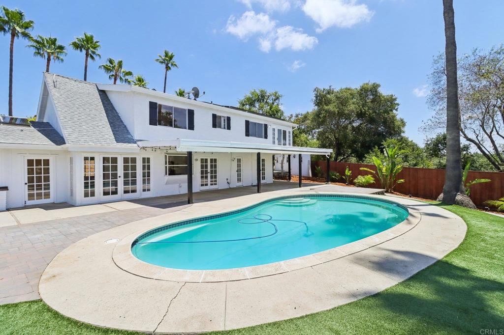 a view of pool with outdoor seating