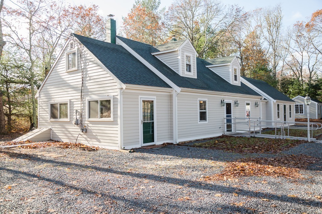 113 Cammett Road Barnstable, MA 02648 - Photo 2 of 28 a front view of a house with a yard