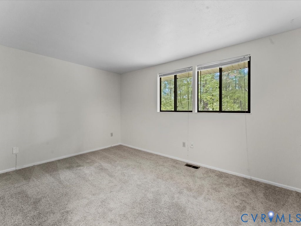 9611 Kennesaw Road Chesterfield, VA 23236 - Photo 19 of 20 an empty room with a window