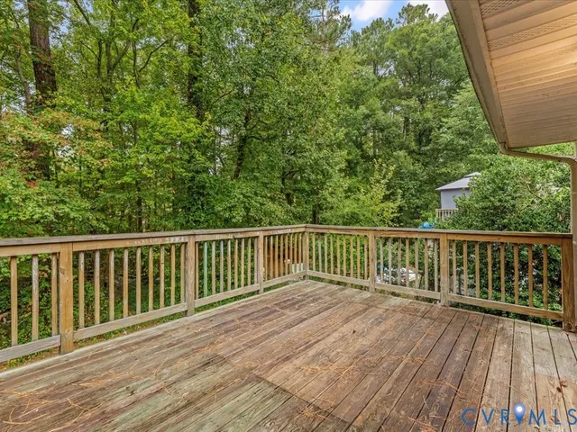a view of balcony with wooden floor