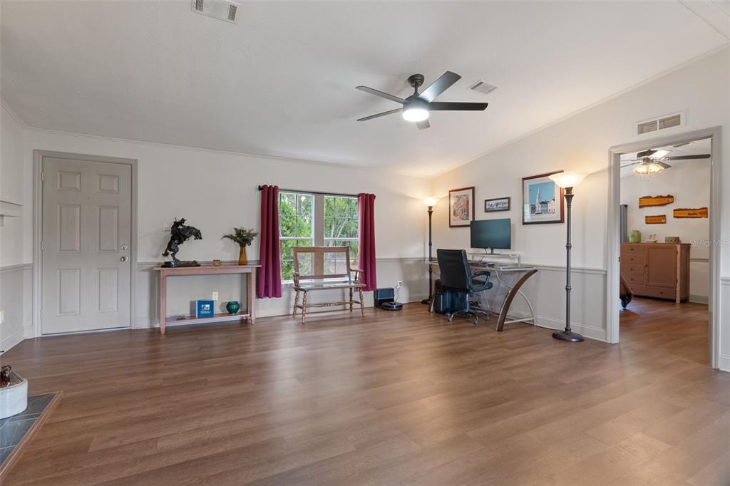 26255 Lambeth Road Brooksville, FL 34601 - Photo 15 of 76 a view of a livingroom with workspace and a window