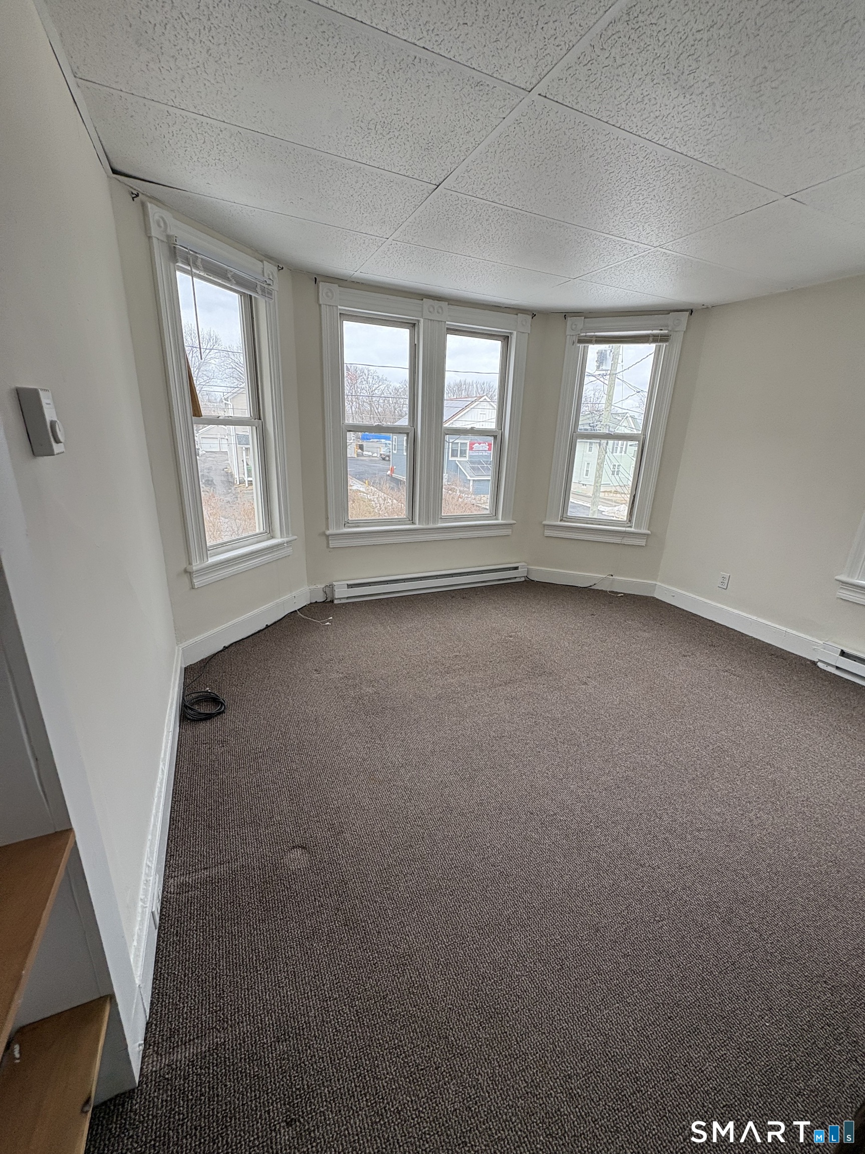 55 Beaver Brook Road, Unit 3 Danbury, CT 06810 - Photo 3 of 8 a view of an empty room with a window