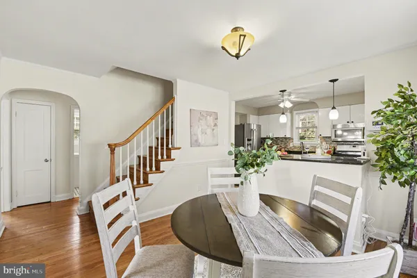a view of kitchen and dining room with wooden floor