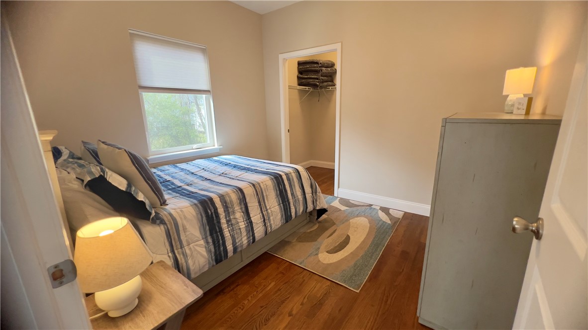 160 Hudgins Lake Road Townville, SC 29689 - Photo 5 of 41 Hardwood floors and a sun-filled window enhance this comfortable sleeping space.