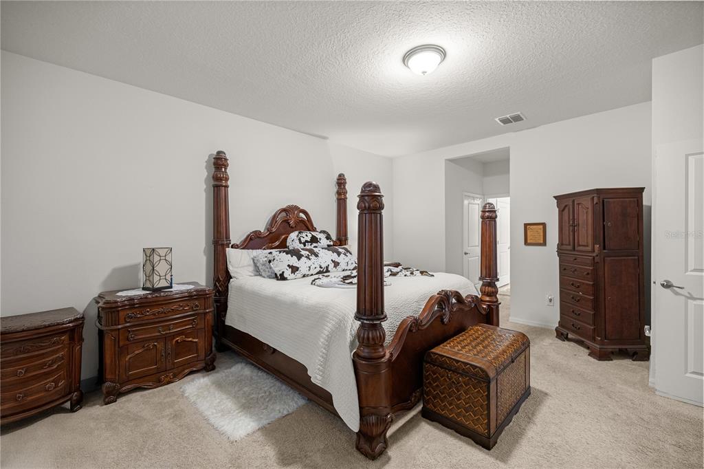 6474 Southwest 89th Loop Ocala, FL 34476 - Photo 12 of 34 a bedroom with furniture and a couch