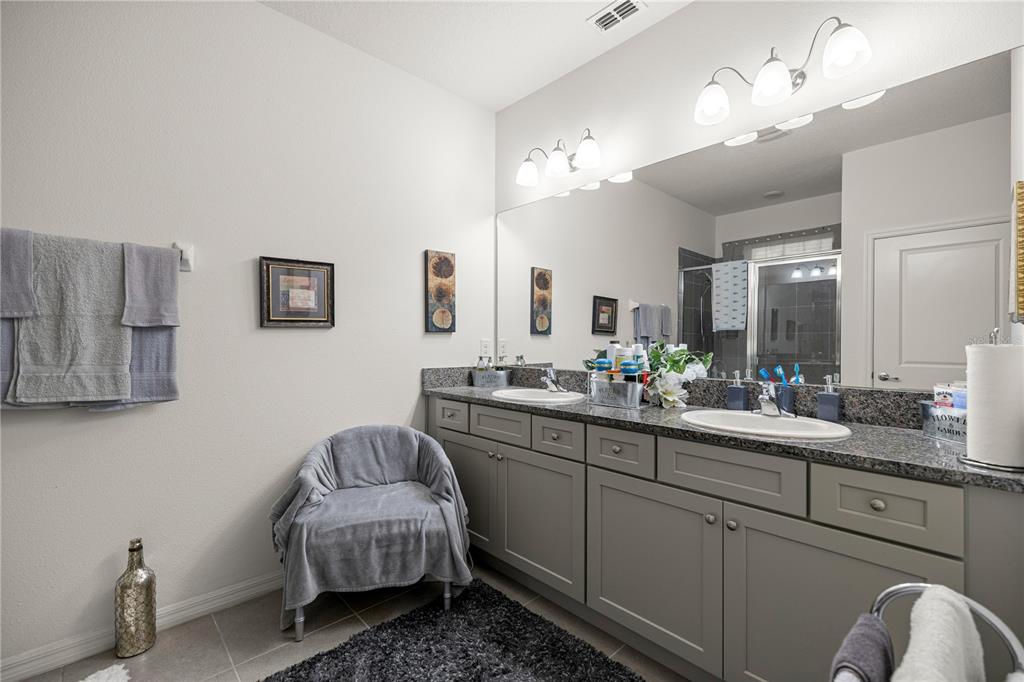 6474 Southwest 89th Loop Ocala, FL 34476 - Photo 13 of 34 a en suite bathroom with a double vanity sink and a mirror