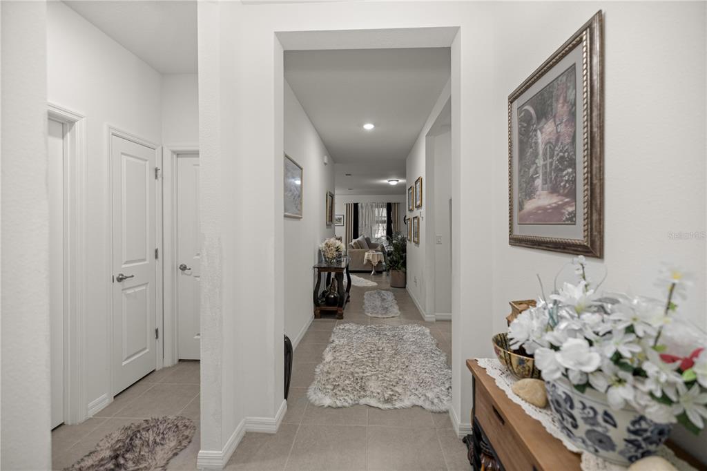 6474 Southwest 89th Loop Ocala, FL 34476 - Photo 2 of 34 a very nice looking room with a large mirror