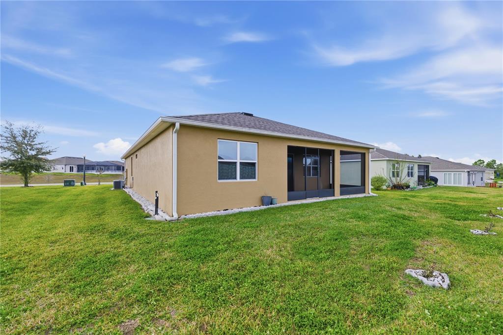 6474 Southwest 89th Loop Ocala, FL 34476 - Photo 23 of 34 a view of a house with backyard and garden
