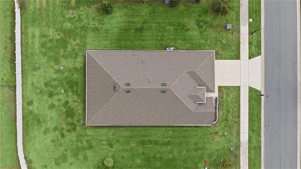 6474 Southwest 89th Loop Ocala, FL 34476 - Photo 25 of 34 an aerial view of a house with a yard