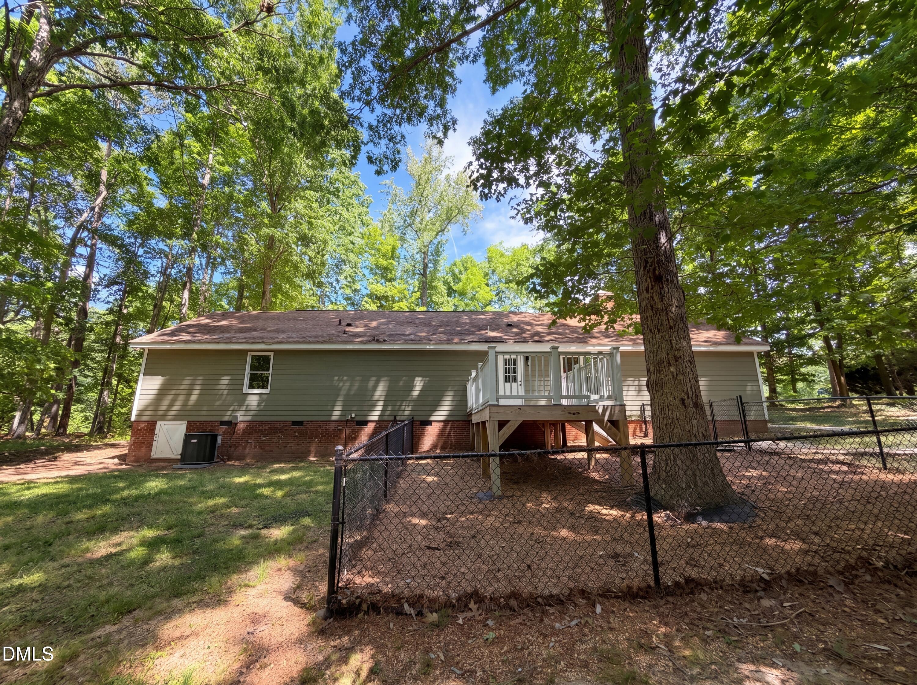 102 Lakeside Farm Road Zebulon, NC 27597 - Photo 18 of 18 a view of a house with backyard