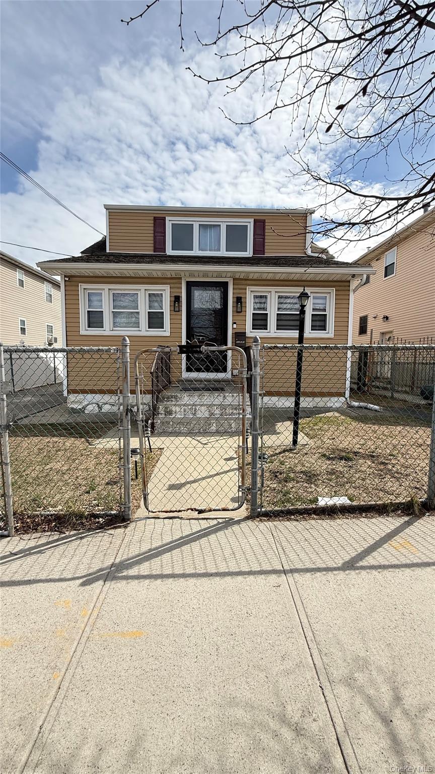 147-15 223rd Street Queens, NY 11413 - Photo 1 of 21 a view of a house with a patio