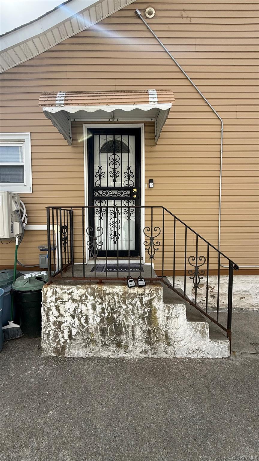 147-15 223rd Street Queens, NY 11413 - Photo 13 of 21 a front view of a house with balcony