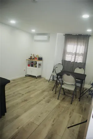 a bedroom with furniture and a mirror