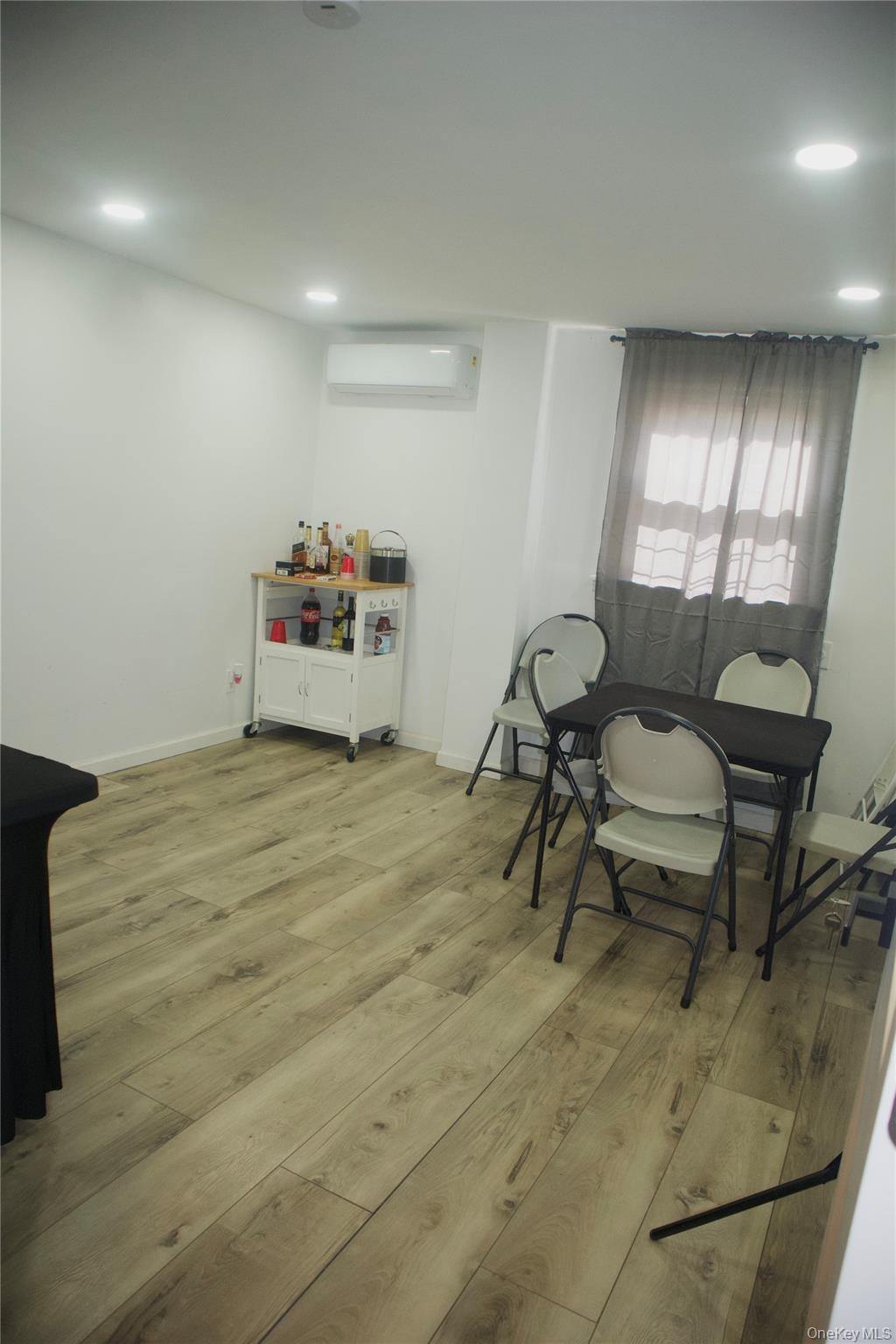 147-15 223rd Street Queens, NY 11413 - Photo 19 of 21 a bed room with a bed and a chair
