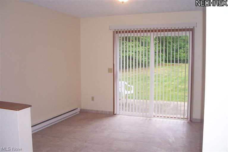 1532 North County Line Road Geneva, OH 44041 - Photo 22 of 22 View of dining room with popular open floor plan leading into kitchen.