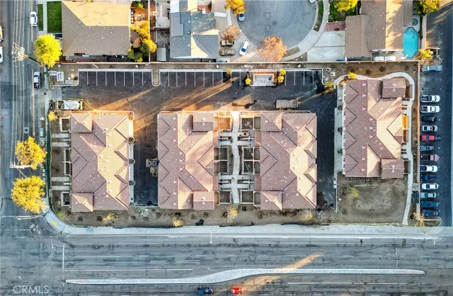 a view of a building with a wooden fence