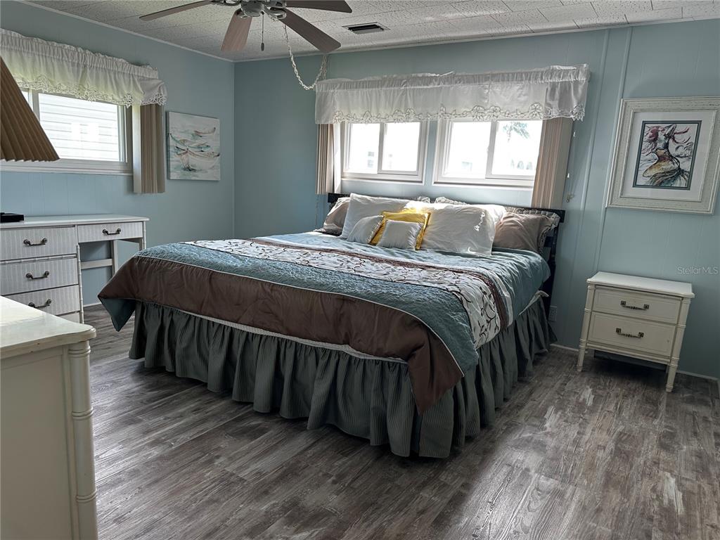 1100 South Belcher Road, Unit 523 Largo, FL 33771 - Photo 11 of 56 a bed sitting in a bedroom next to a window