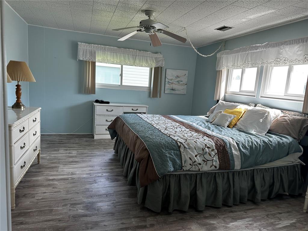 1100 South Belcher Road, Unit 523 Largo, FL 33771 - Photo 12 of 56 a bedroom with a bed and window