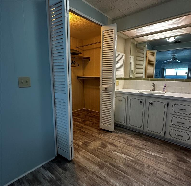 1100 South Belcher Road, Unit 523 Largo, FL 33771 - Photo 13 of 56 a view of a bathroom with a sink mirror and window