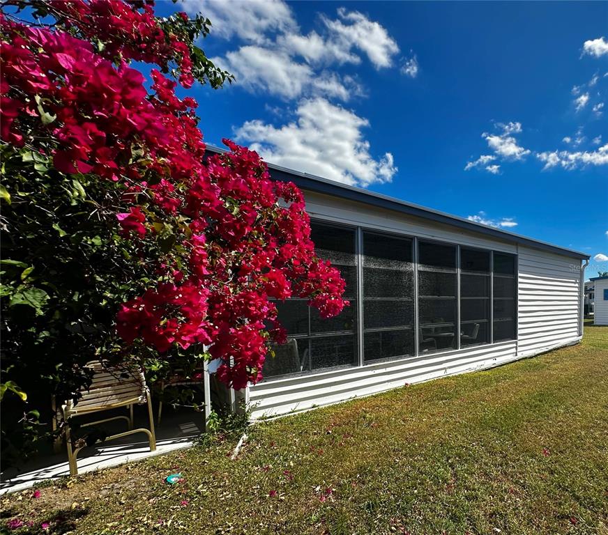 1100 South Belcher Road, Unit 523 Largo, FL 33771 - Photo 2 of 56 a front view of a house with a tree