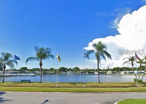 1100 South Belcher Road, Unit 523 Largo, FL 33771 - Photo 24 of 56 a view of a swimming pool and an outdoor space