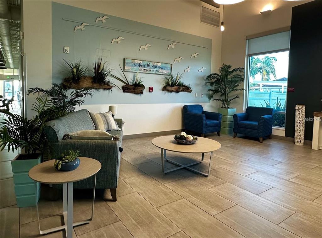 1100 South Belcher Road, Unit 523 Largo, FL 33771 - Photo 29 of 56 a living room with furniture and a potted plant