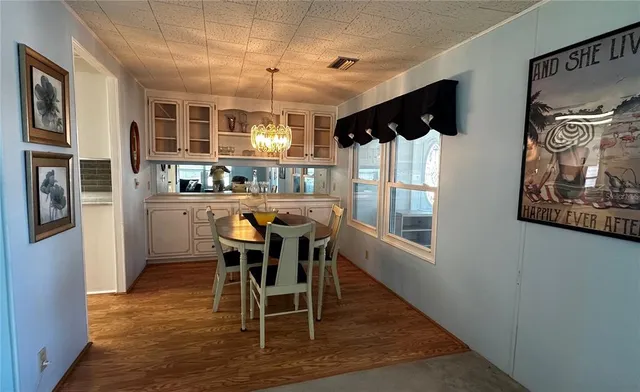 a dining room with furniture and window