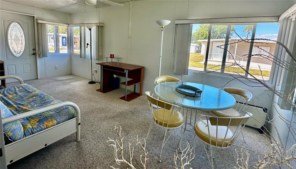 1100 South Belcher Road, Unit 523 Largo, FL 33771 - Photo 10 of 56 a living room with furniture and a large window