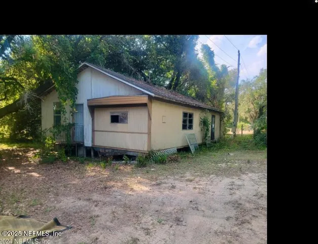 a backyard of a house with lots of green space