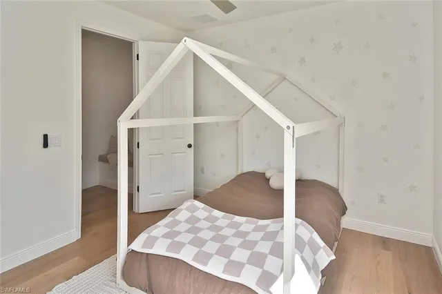 a bedroom with a bed and a table