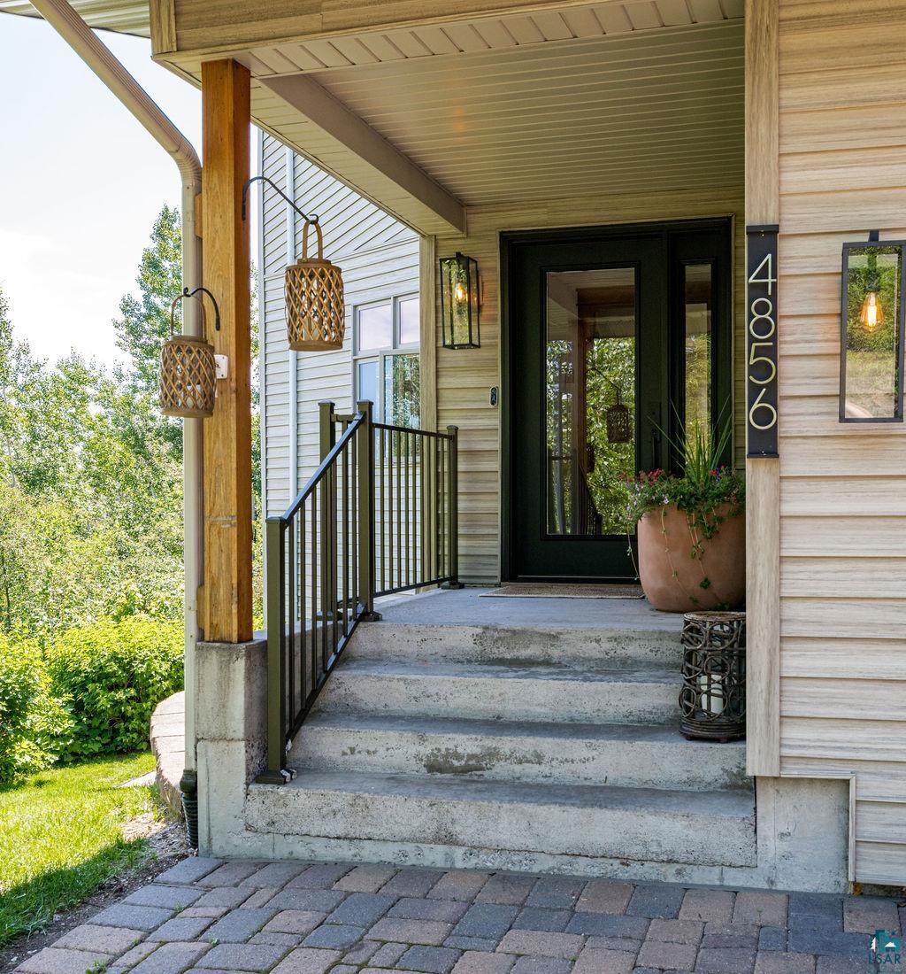 4856 Kingston Street Duluth, MN 55804 - Photo 71 of 88 Covered front porch featuring a dark wood-finish support beam and concrete steps