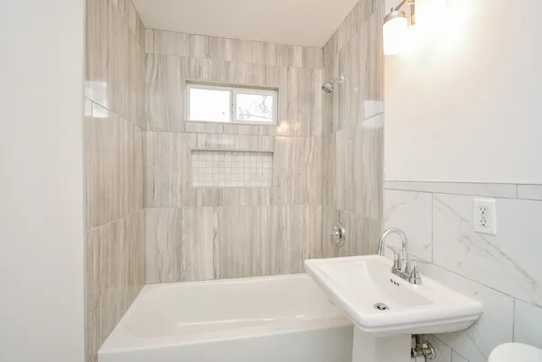 a bathroom with a sink and a bathtub
